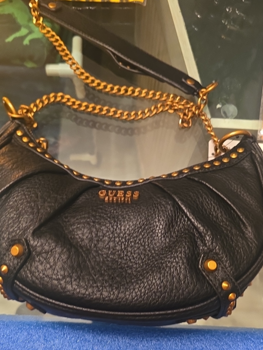 GUESS Black Shoulder Saddle Bag with Gold Chain and Stud Accents